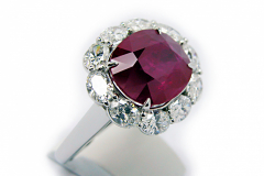 Oval Ruby with Oval Diamonds Halo Ring